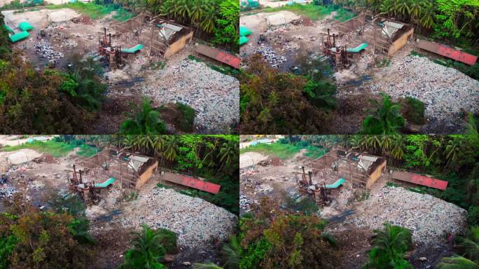 热带岛屿上的垃圾焚烧厂，热带地区污染空气和土壤的垃圾桶鸟瞰图，用明火燃烧塑料，将塑料垃圾堆积起来回收