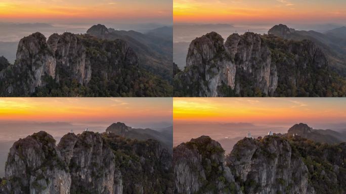 视频4K解决方案，白塔和佛塔在山崖上的林地称为Wat Phra Bat Pupha Daeng寺，泰
