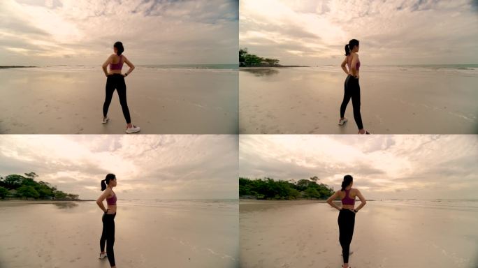 女人在沙滩上跑步身体四肢拉伸左右扭动身体