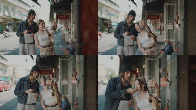 街头之恋:亚洲夫妇在曼谷老城区的活力之旅。