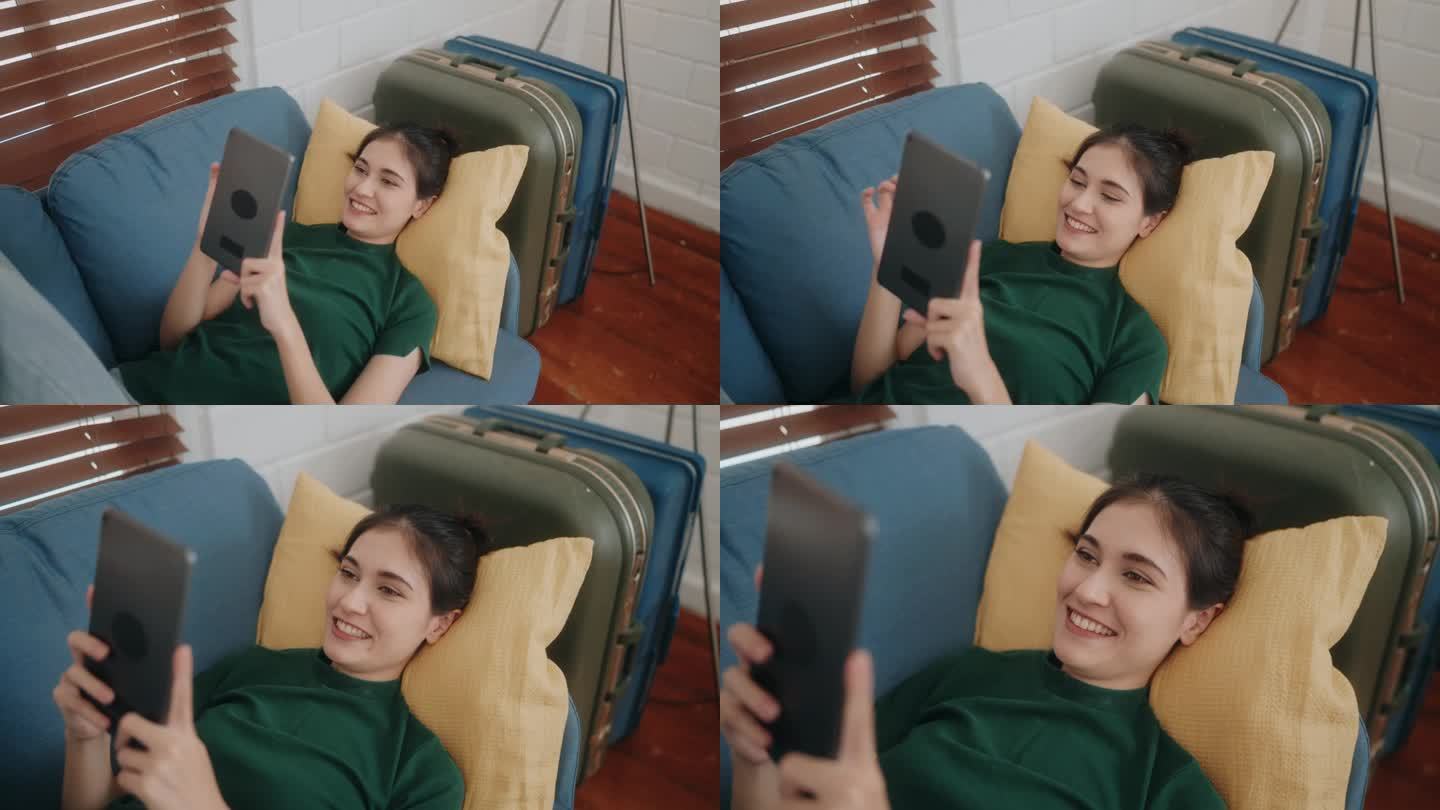 拥抱现代生活方式:年轻女性用平板电脑上网，在家沙发上休闲。