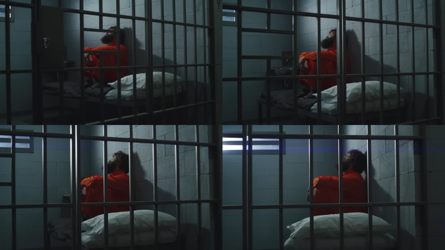 穿着橙色制服的罪犯坐在牢房的床上