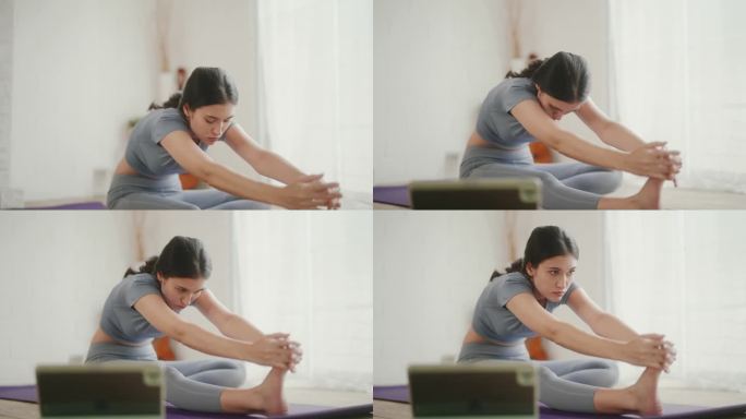 现代生活方式:在线瑜伽课在笔记本电脑上的健康和灵活性。