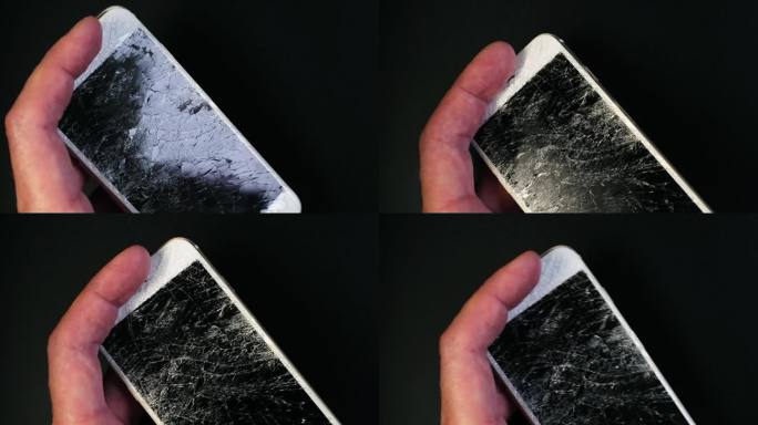 手机屏幕坏了。智能手机玻璃上有很多裂缝。错误的工具。屏幕破碎的手机