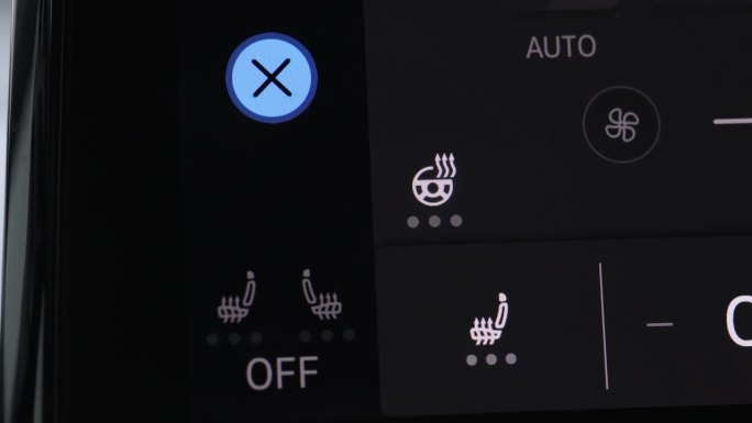 按下按钮开启汽车加热座椅。汽车加热座椅仪表盘。打开车内座椅加热按钮