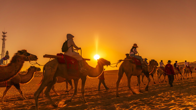 鸣沙山月牙泉沙漠骆驼日落延时素材