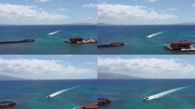 在夏威夷西毛伊岛的Maalaea港，一艘船进入码头的空中下降特写镜头。4 k