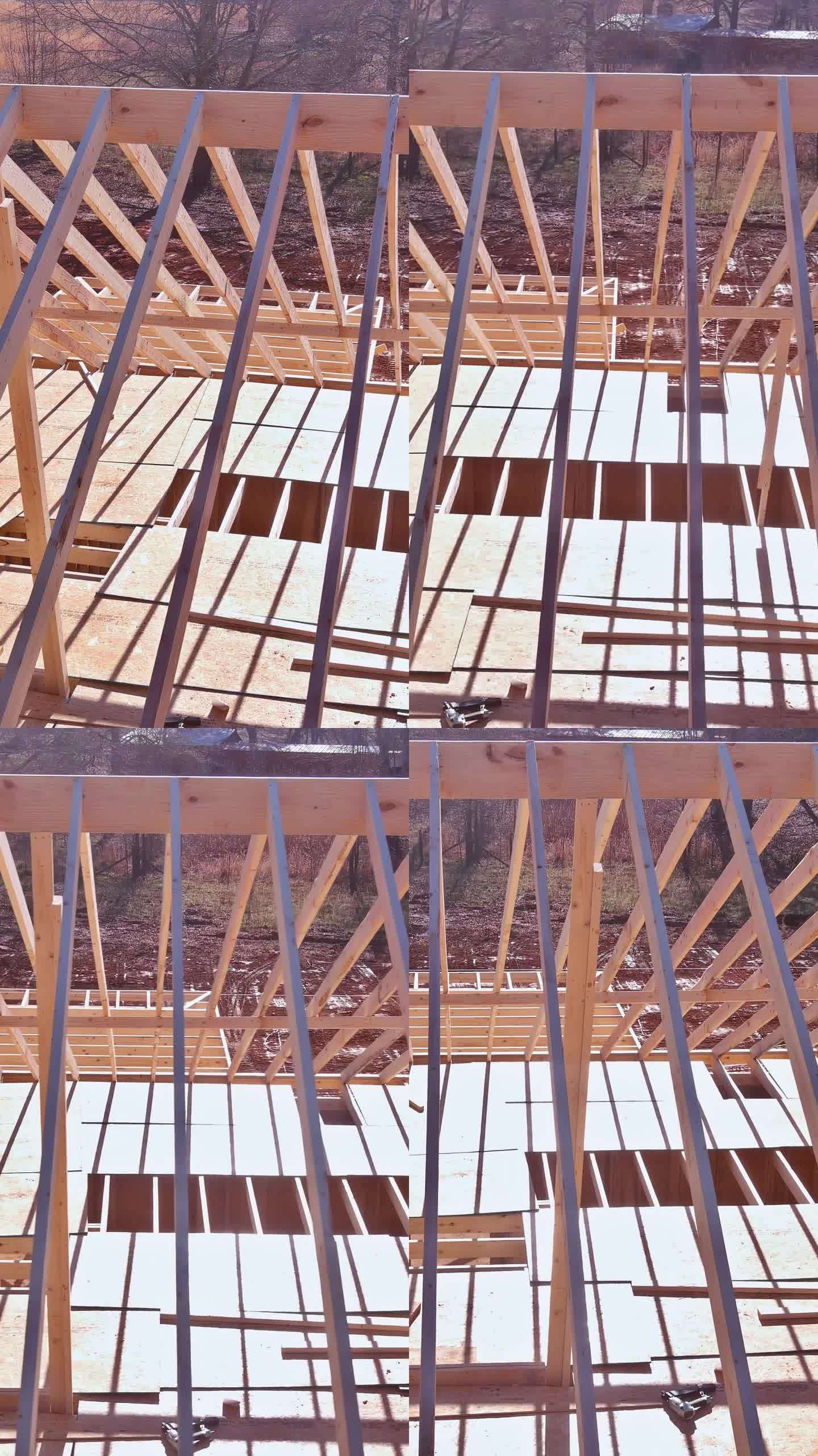 在房屋建造过程中，使用桁架和木制框架建造了一个梁棍房屋