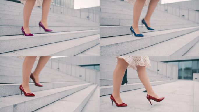 一个美丽的商业女性的特写，她的腿穿着颜色多变的高跟鞋走下楼梯
