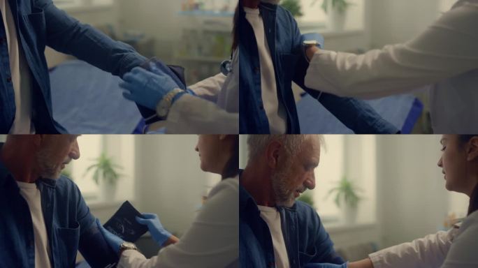 女医生将测量血压的袖带放在老人的手臂上。