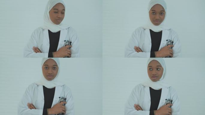 美丽迷人的穆斯林医生用听诊器为女青年诊察病人。