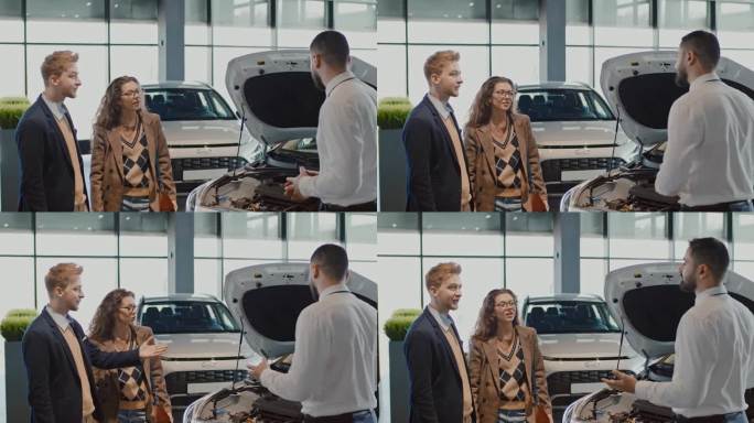 男汽车销售经理在展示厅咨询年轻夫妇