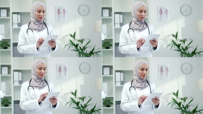 在一家现代医院的诊所里，身穿白大褂的穆斯林女医生正在平板电脑上使用浏览式打字