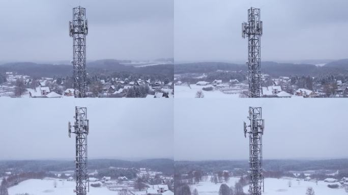 塔式天线电信手机鸟瞰图，蜂窝5g 4g手机无线电发射机。提供高速现代5g通信网服务。雪自然森林冬季。