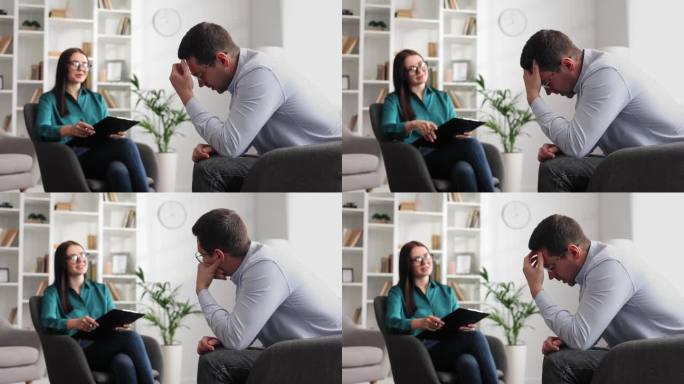 一位专业的心理学家正在咨询一位坐在办公室椅子上的压力和抑郁状态的男性病人。她写在纸上。咨询心理学家的