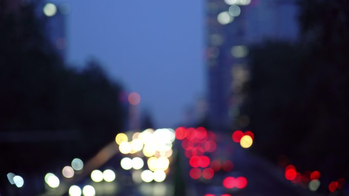 中国北京夜晚城市道路虚化光斑汽车交通景观