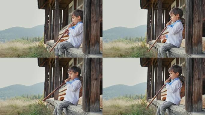 可爱的男孩演奏木管木笛-乌克兰索菲亚卡。民间音乐概念。乐器。小孩穿着传统的刺绣衬衫-维希亚万卡。孩子