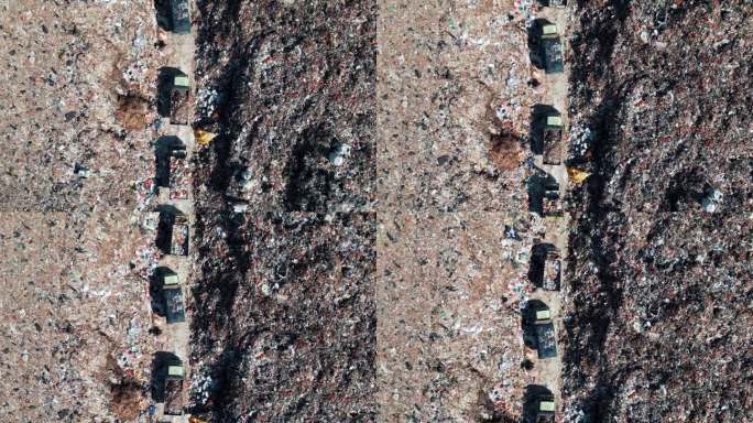 大型垃圾场和垃圾车与垃圾在空中俯视图。堆满垃圾的大垃圾堆填区。生态系统土地损害污染概念。有推土机和工
