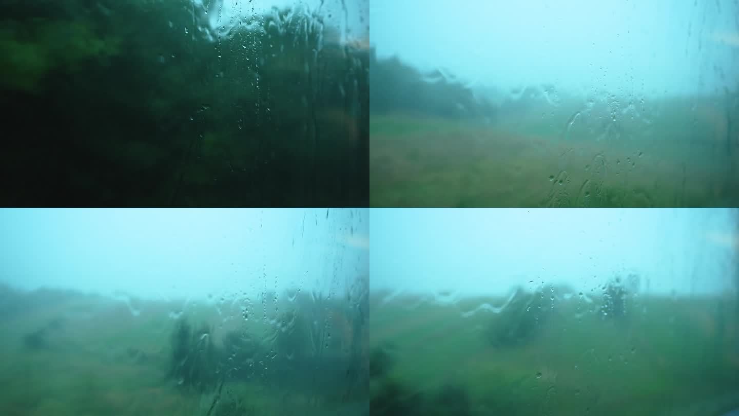 大雨中透过火车窗户看到的景象。雨滴顺着窗玻璃流下来。火车窗外下着大雨。在雨中乘火车去山里旅行的梦幻气