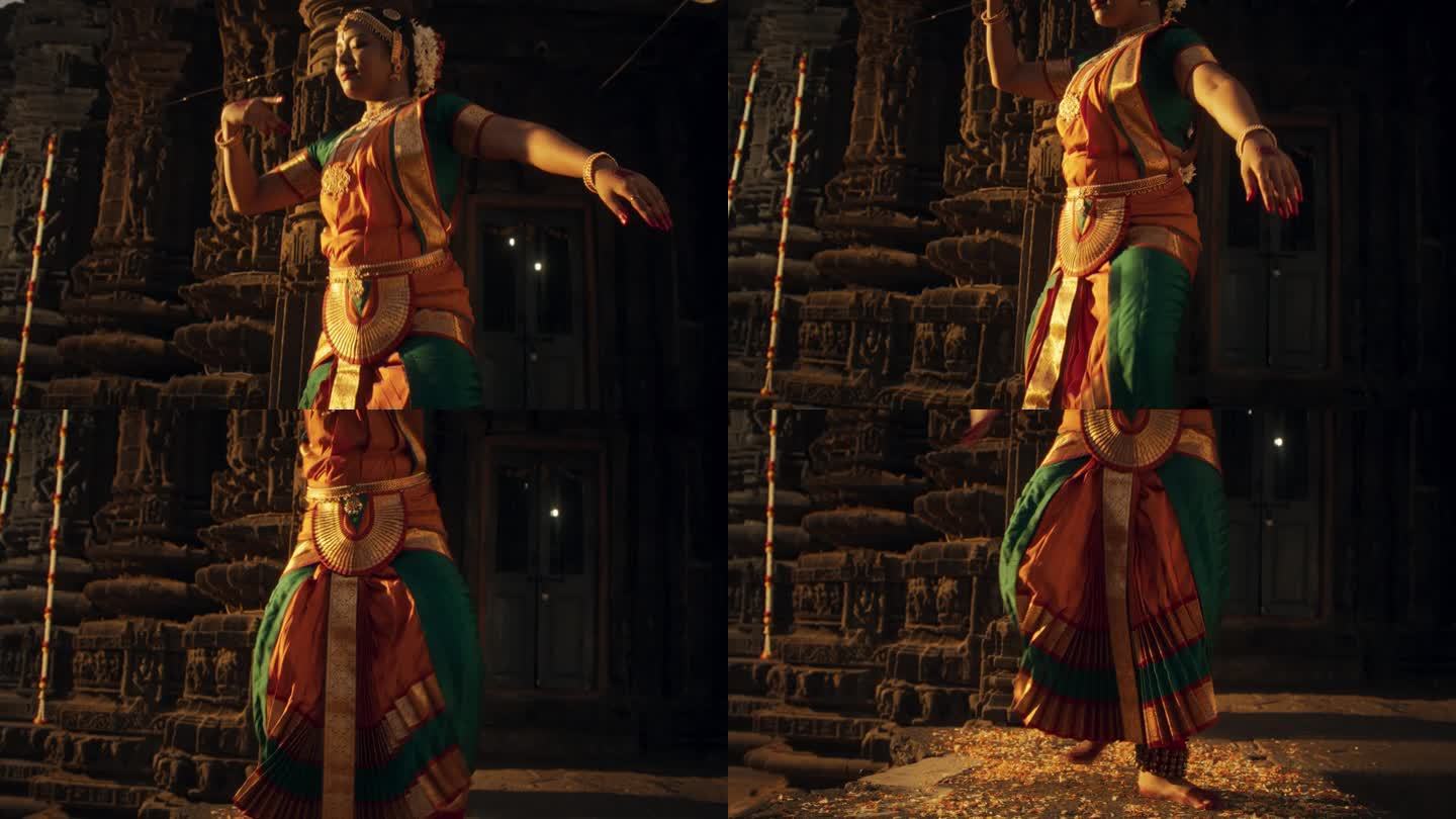 精力充沛的印度妇女在跳Bharatanatyam时，展示了她的腿在传统服装中的优雅运动。女舞者在古庙