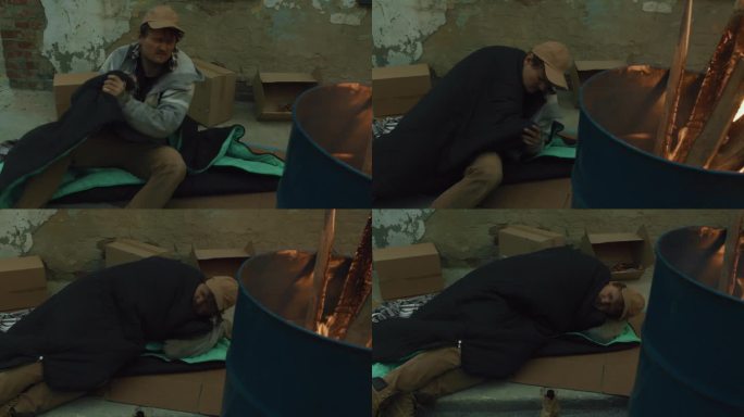 无家可归的人在纸板上睡着了