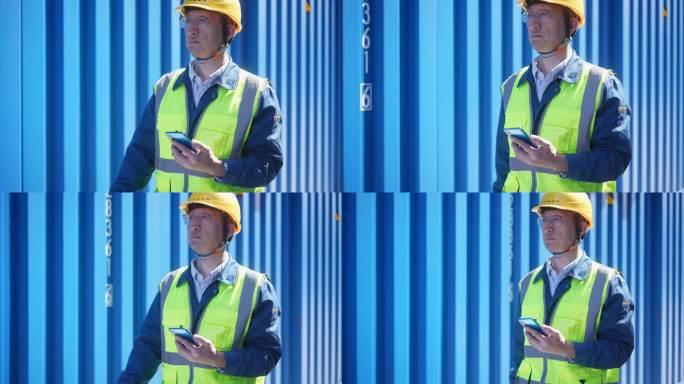 中年男人工程师在集装箱码头使用手机工作