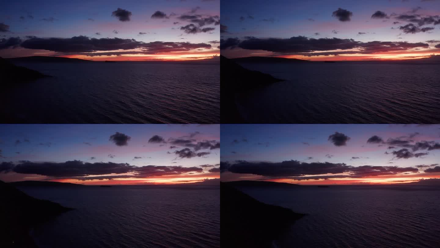 黄昏时分，夏威夷毛伊岛海岸外神圣的卡奥拉维岛和莫洛基尼火山口的空中全景。4 k