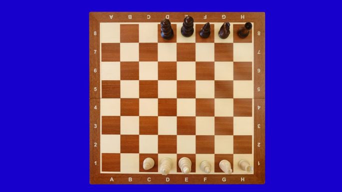 在棋盘上排列棋子的俯视图，停止运动。棋局一开始，视频就上了chromakey