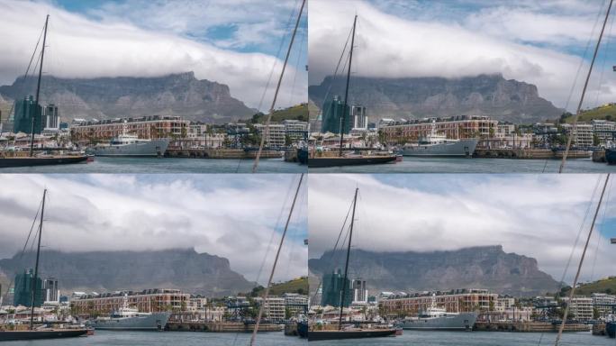 维多利亚港和阿尔弗雷德海滨在开普敦，南非。云台山在背景。间隔拍摄