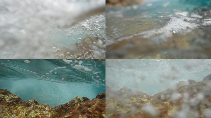 摄像机捕捉到了海浪撞击岩石，将其完全淹没在水中，然后又退回大海的画面。慢镜头特写