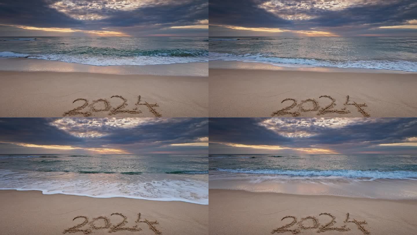 清晨在沙滩岸边，文字2024新年快乐在沙滩上，海面日出美景