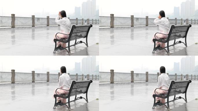 雨中女子独自坐在椅子上