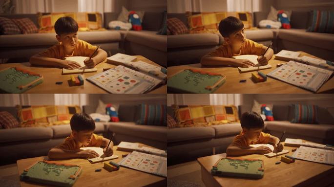 一个聪明的小男孩在客厅里勤奋地做作业的晚照。专注儿童学习，学习最好的成绩，写数学答案。高成就的韩国孩