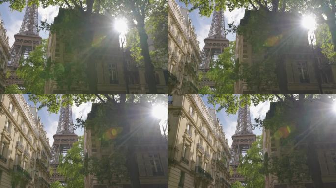 日落。从巴黎一条著名的街道上俯瞰埃菲尔铁塔。位于首都中心的巴黎式房屋建筑。背景是巴黎的标志性建筑铁塔