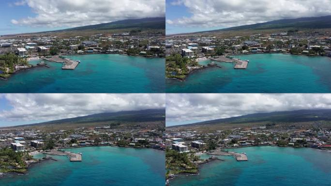 在夏威夷大岛上，沿着历史悠久的科纳镇拍摄的凯卢阿湾的航拍全景。4 k
