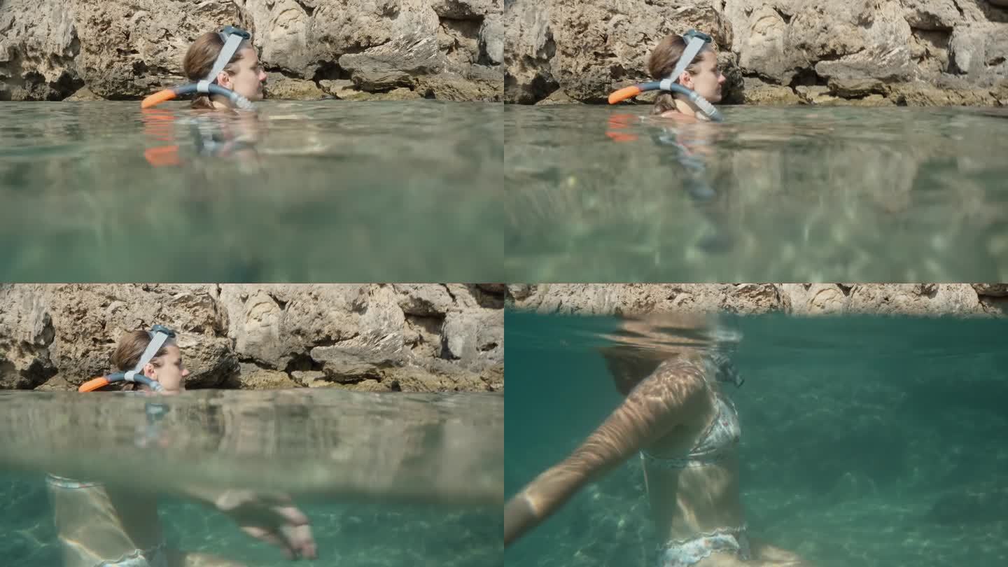 这是一位戴着潜水面罩的年轻女子半水下的照片，背景是海中的悬崖。