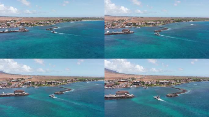 在夏威夷西毛伊岛的Maalaea港，一艘船进入码头的航拍宽跟踪镜头。4 k