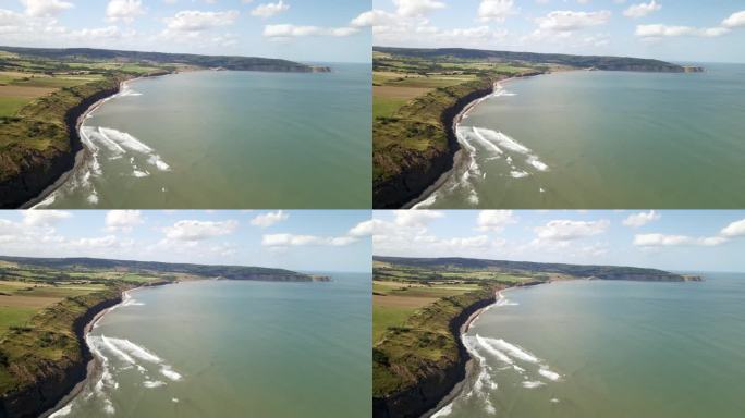 无人机拍摄的北约克郡海岸线，绿色的田野和海洋。