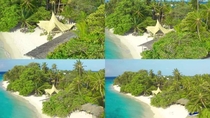 法属波利尼西亚的波拉波拉岛，从空中俯瞰白色沙滩上的茅草小屋和郁郁葱葱的热带岛屿。