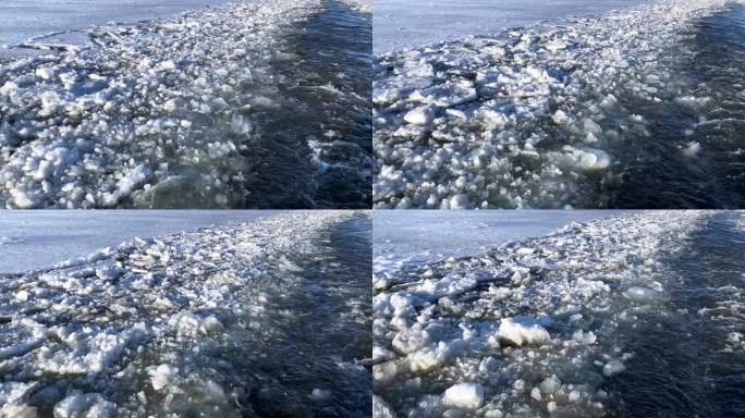 拖船沿着结冰的河流行驶后，水面上的痕迹。冰漂过程中水运的运动