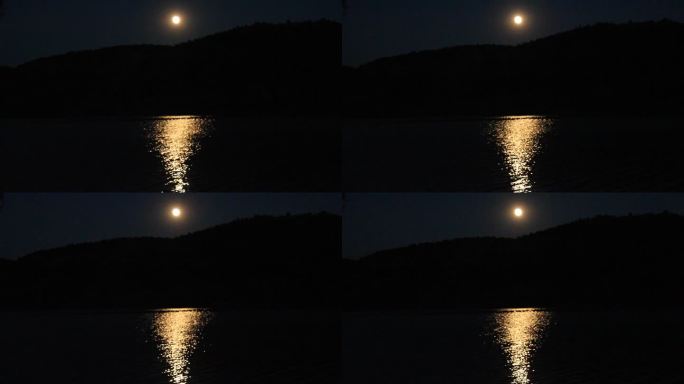月光照在海面上。海闪闪发光。月亮在水中的倒影