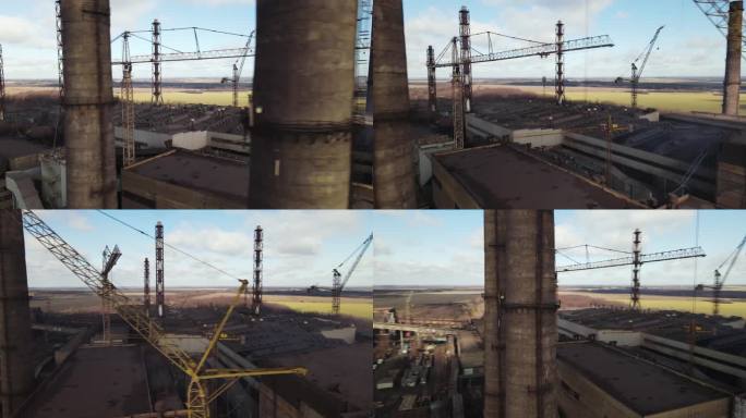 无人机拍摄的钢铁厂管道航拍画面。在冶金厂的上空，一团烟雾正从烟囱里冒出来。