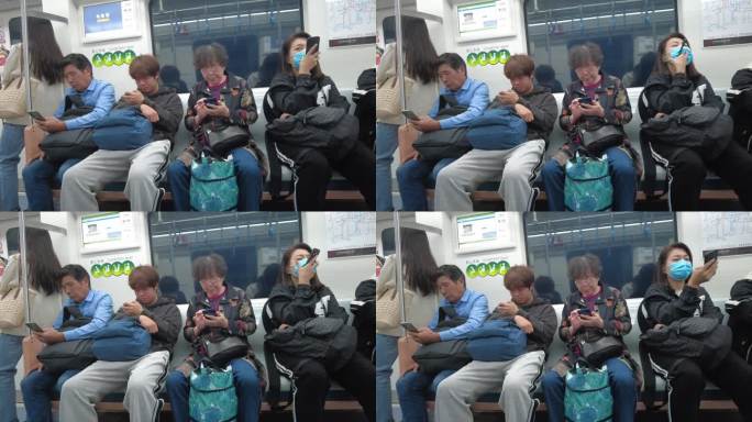 玩手机 火车上 休息 低头族 坐地铁