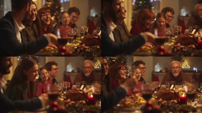 亲密的家庭晚餐设置与一群不同的亲戚庆祝圣诞节，在装饰客厅的大桌子上一起用餐。亲人谈笑风生，享受美食