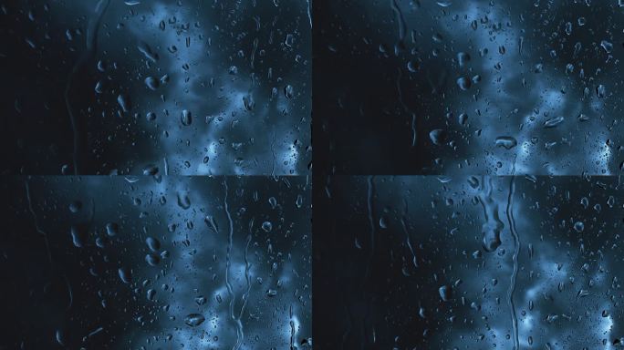 雨滴在窗口深蓝色抽象背景
