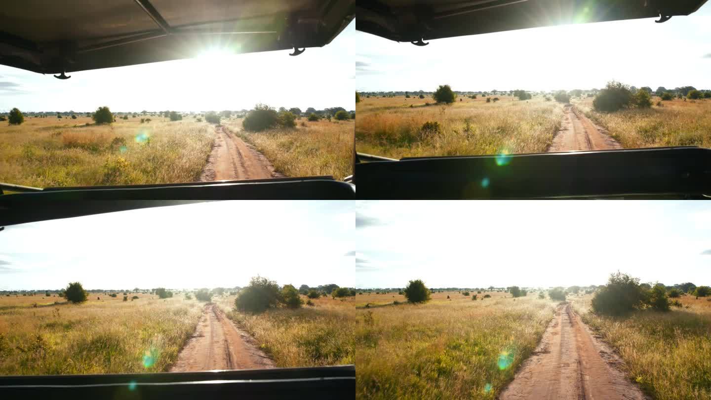 在泥泞的道路上驾车穿越坦桑尼亚美丽的风景