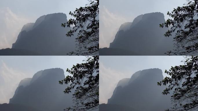 阳光山峰树叶峡谷丁达尔光耶稣光
