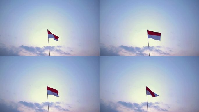 印度尼西亚国旗在洁白的天空背景下飘扬