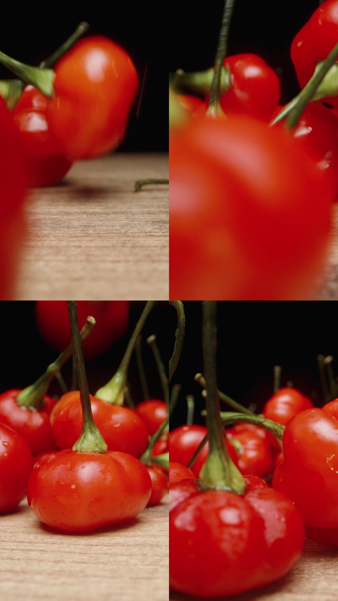 垂直视频。“火鸡之星”品种的微红辣椒以慢镜头落在桌子上。微距滑块拍摄。
