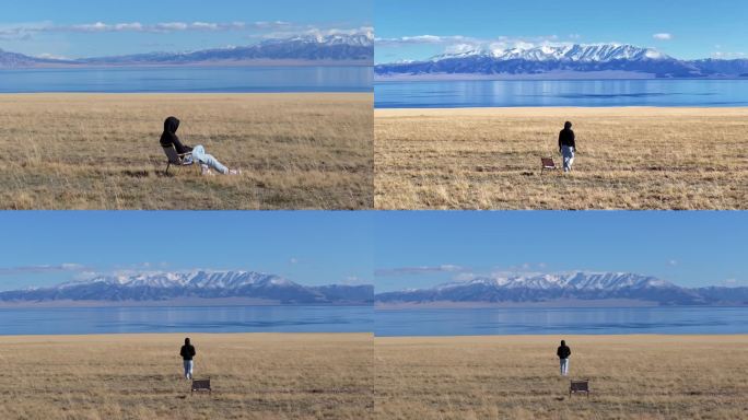 航拍男子在秋天的新疆赛里木湖畔玩耍